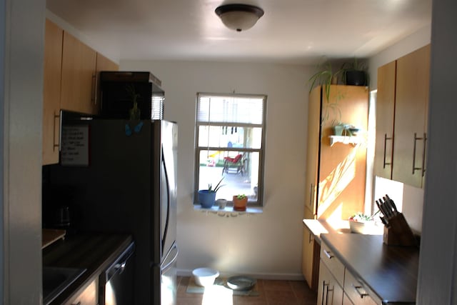 126 E Saint Andrew St, Rapid City, SD 57701 - kitchen with freestanding refrigerator and tile patterned floors
