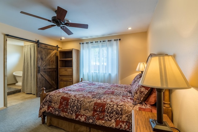 627 W Mt Rushmore Rd, Custer, SD 57730 - carpeted bedroom featuring a barn door, recessed lighting, connected bathroom, and a ceiling fan