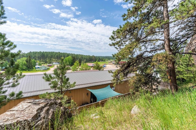 627 W Mt Rushmore Rd, Custer, SD 57730 - view of yard featuring a forest view and an outbuilding