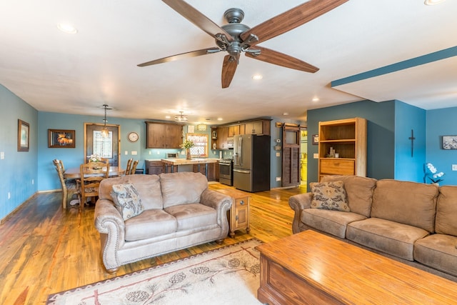 627 W Mt Rushmore Rd, Custer, SD 57730 - living area with light wood-type flooring, recessed lighting, and ceiling fan