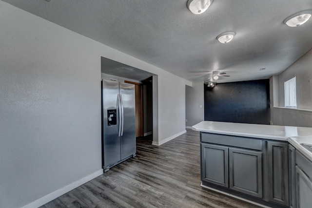 212 E Custer St, Rapid City, SD 57701 - kitchen featuring stainless steel fridge, gray cabinets, a textured ceiling, dark wood-type flooring, and a ceiling fan