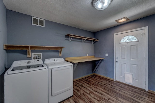 212 E Custer St, Rapid City, SD 57701 - washroom with washer and clothes dryer, wood finished floors, and a textured ceiling