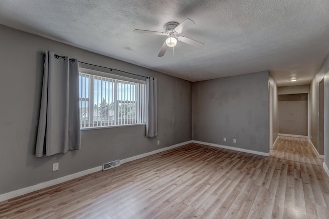 212 E Custer St, Rapid City, SD 57701 - unfurnished room with wood finished floors, a textured ceiling, and ceiling fan