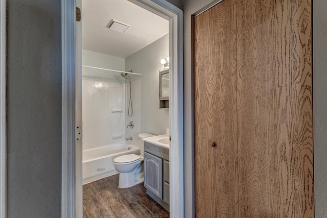 212 E Custer St, Rapid City, SD 57701 - bathroom with vanity, wood finished floors, and bathtub / shower combination
