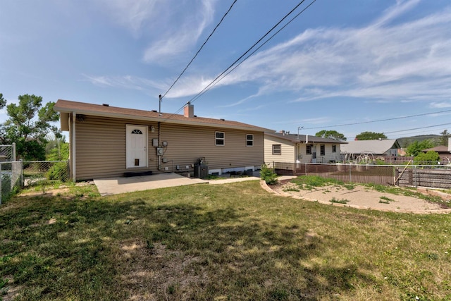 212 E Custer St, Rapid City, SD 57701 - back of property featuring a patio area and a fenced backyard
