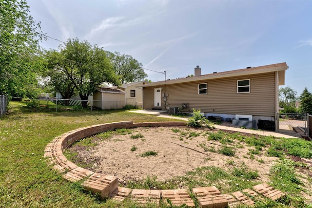 212 E Custer St, Rapid City, SD 57701 - back of house with a fenced backyard and a patio