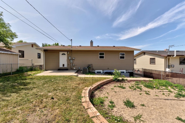 212 E Custer St, Rapid City, SD 57701 - back of house featuring a patio and a chimney