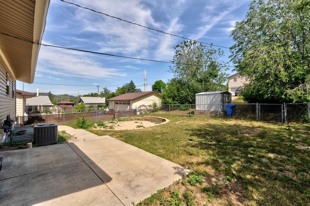 212 E Custer St, Rapid City, SD 57701 - fenced backyard featuring a patio area, an outdoor structure, and a gate