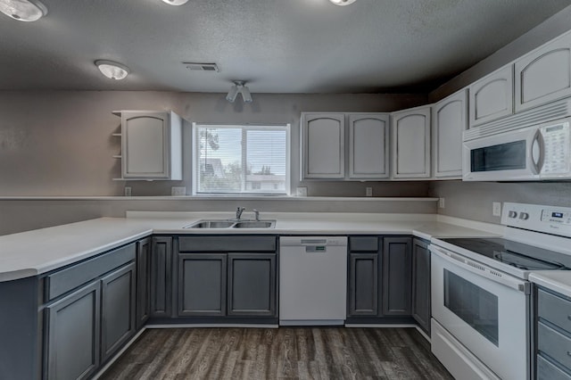 212 E Custer St, Rapid City, SD 57701 - kitchen with white appliances, gray cabinets, dark wood-type flooring, a textured ceiling, and open shelves