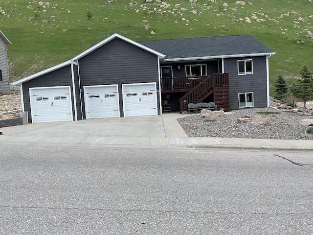 772 Stage Run Rd, Deadwood, SD 57732 - ranch-style home with stairway, a garage, and covered porch