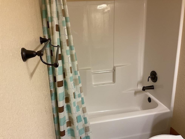 772 Stage Run Rd, Deadwood, SD 57732 - bathroom with a textured wall and shower / tub combo