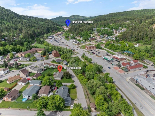 10 Crescent Dr, Deadwood, SD 57732 - aerial view of property's location featuring a mountainous background and nearby suburban area