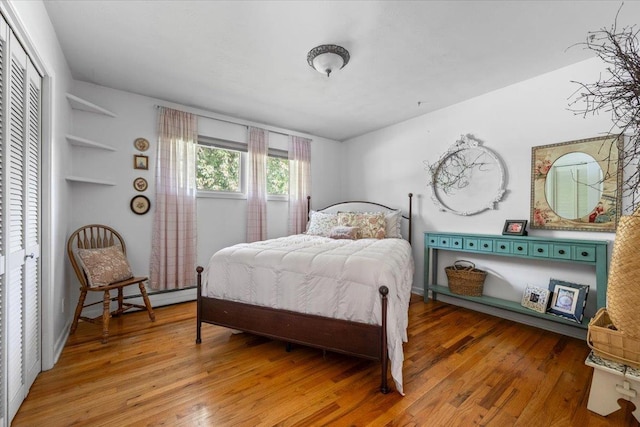 10 Crescent Dr, Deadwood, SD 57732 - bedroom with wood finished floors and a baseboard heating unit