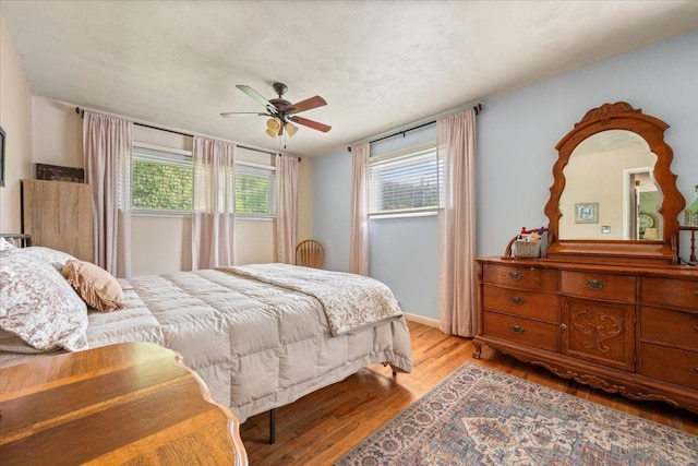 10 Crescent Dr, Deadwood, SD 57732 - bedroom with light wood finished floors and ceiling fan