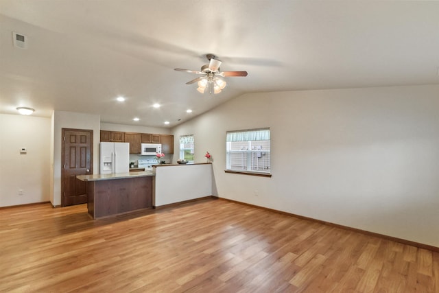 1205 Silverbrook Ln, Spearfish, SD 57783 - unfurnished living room featuring light wood finished floors, ceiling fan, vaulted ceiling, and recessed lighting