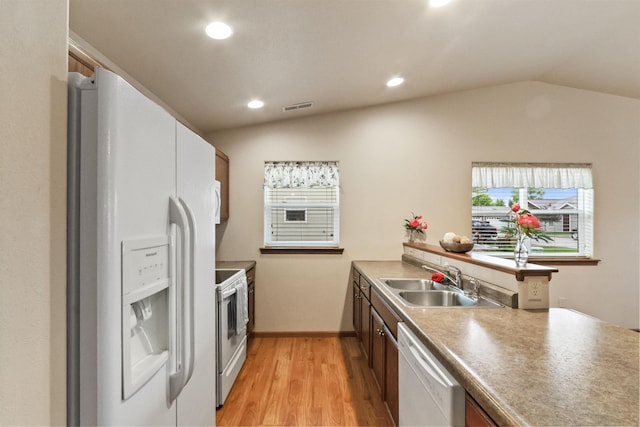 1205 Silverbrook Ln, Spearfish, SD 57783 - kitchen with white appliances, light wood-style flooring, lofted ceiling, healthy amount of natural light, and recessed lighting