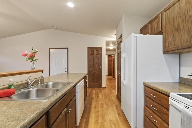 1205 Silverbrook Ln, Spearfish, SD 57783 - kitchen featuring light wood-style flooring, vaulted ceiling, white appliances, and brown cabinets