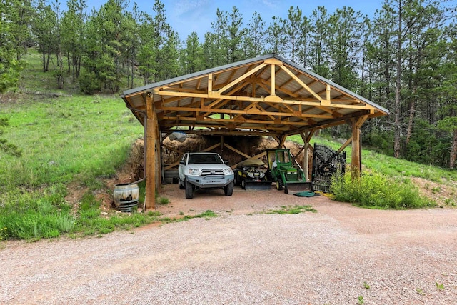12817 Echo Rd, Hot Springs, SD 57747 - view of parking with a detached carport and dirt driveway