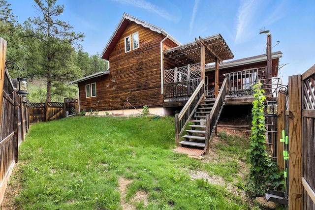 12817 Echo Rd, Hot Springs, SD 57747 - rear view of house with a fenced backyard, a wooden deck, and stairs