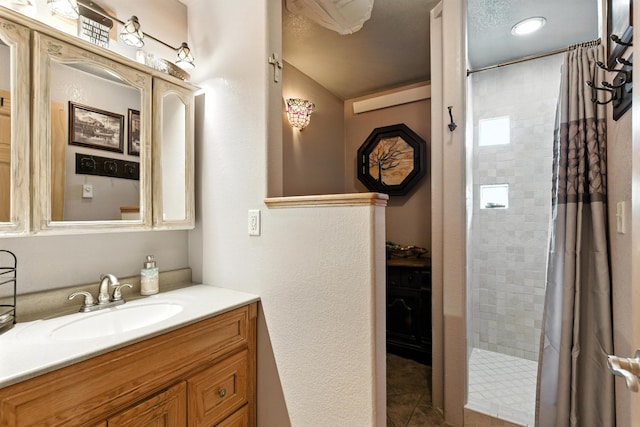 12817 Echo Rd, Hot Springs, SD 57747 - full bathroom featuring vanity, a tile shower, and tile patterned flooring