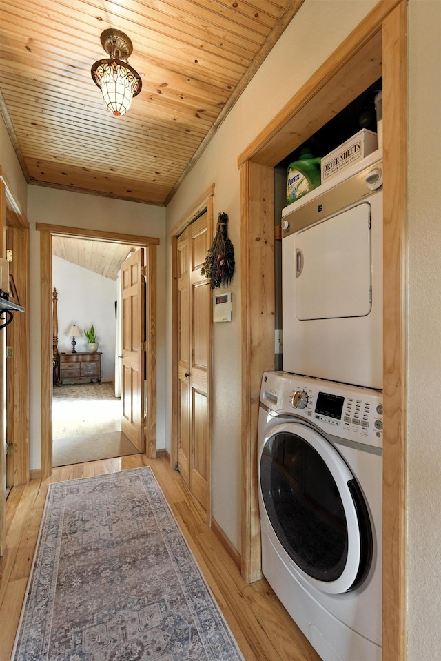 12817 Echo Rd, Hot Springs, SD 57747 - laundry room featuring stacked washing machine and dryer, wood ceiling, and light wood finished floors