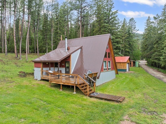 12425 Misty Ln, Nemo, SD 57759 - rear view of property with a lawn, a wooden deck, a metal roof, a wooded view, and a chimney