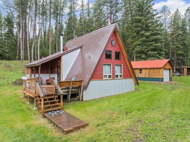 12425 Misty Ln, Nemo, SD 57759 - back of property with a yard, a wooden deck, a metal roof, and an outbuilding