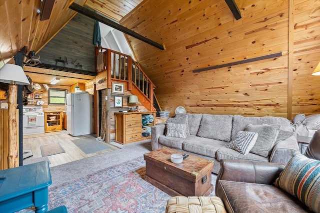 12425 Misty Ln, Nemo, SD 57759 - living room with wooden walls, lofted ceiling, wood ceiling, and stairway