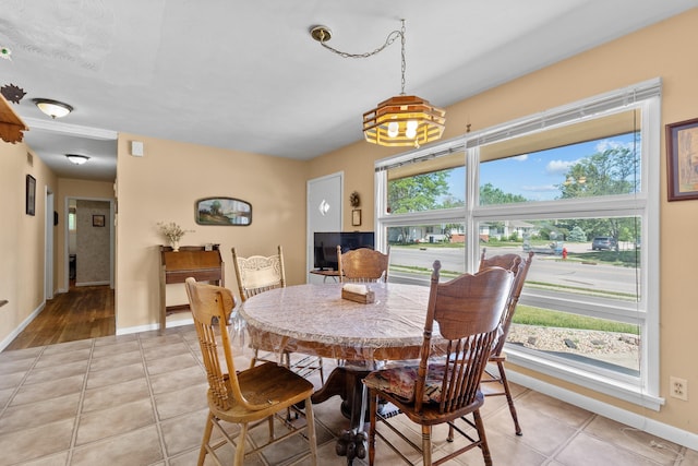 4103 W Main St, Rapid City, SD 57702 - dining room featuring plenty of natural light, light tile patterned floors, and a chandelier