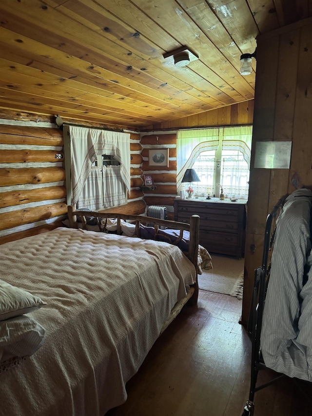 21454 US Highway 85, Lead, SD 57754 - bedroom with wood ceiling, rustic walls, and hardwood / wood-style flooring
