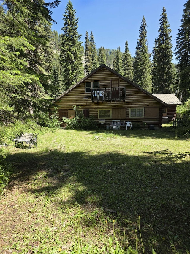 21454 US Highway 85, Lead, SD 57754 - view of side of home featuring a lawn and a wooded view