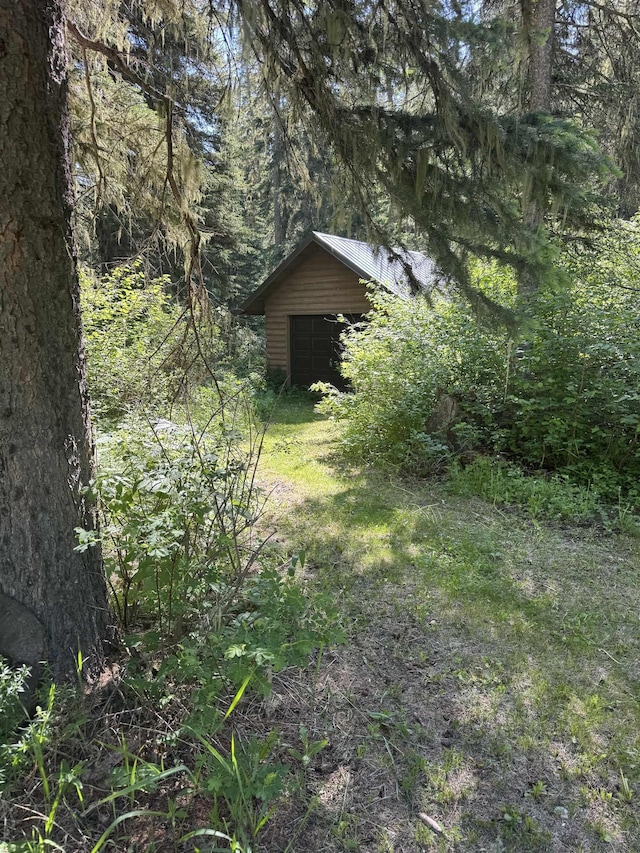 21454 US Highway 85, Lead, SD 57754 - view of yard featuring a wooded view and an outdoor structure