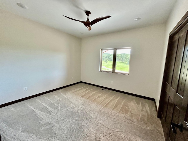 25809 Sidney Trl, Custer, SD 57730 - unfurnished bedroom featuring light carpet and a ceiling fan