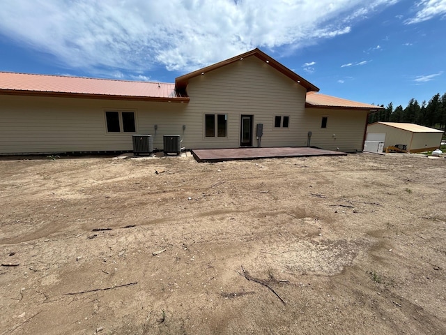 25809 Sidney Trl, Custer, SD 57730 - back of house with a metal roof and a deck
