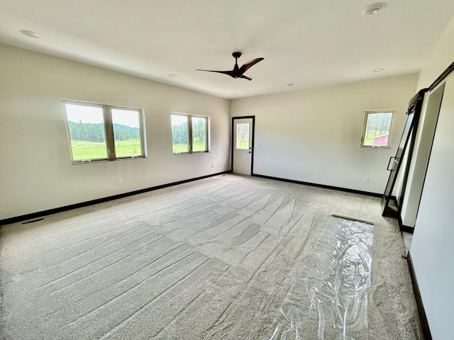 25809 Sidney Trl, Custer, SD 57730 - empty room featuring light colored carpet, healthy amount of natural light, and recessed lighting
