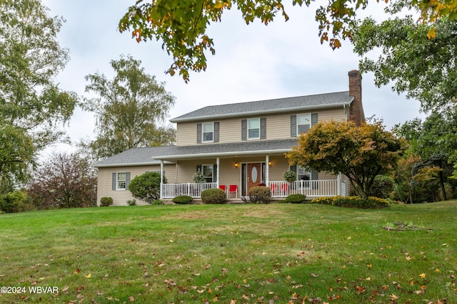 view of front facade with a front lawn and a porch