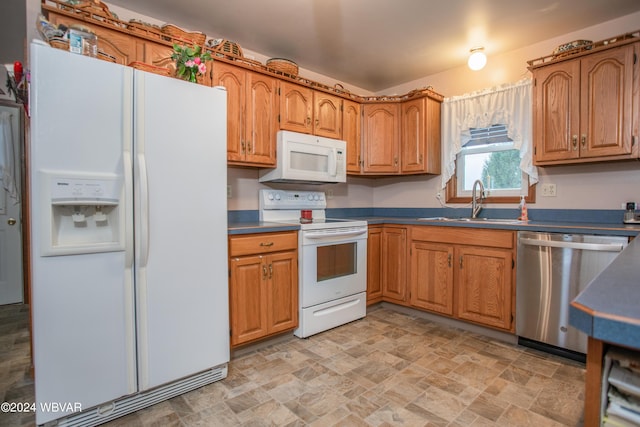 kitchen with white appliances and sink