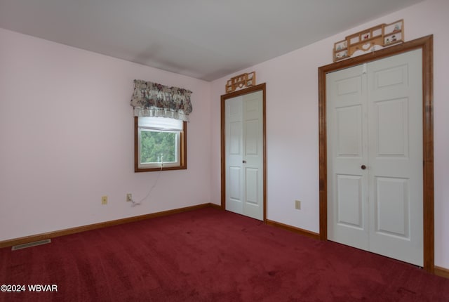 unfurnished bedroom with carpet floors and a closet