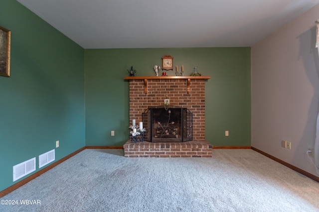 unfurnished living room with a fireplace and carpet flooring