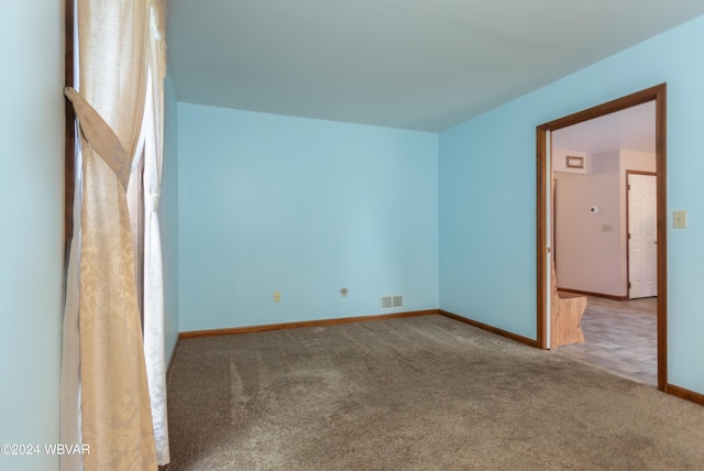 unfurnished room featuring carpet flooring