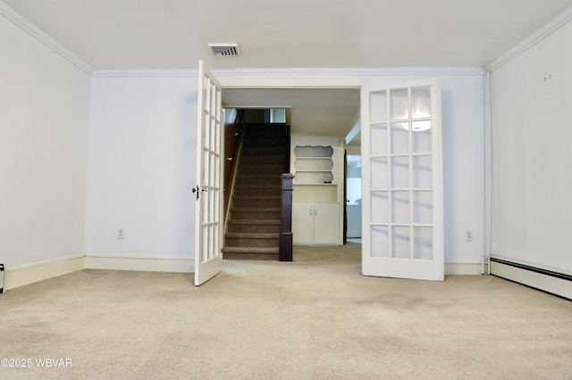 carpeted spare room featuring ornamental molding