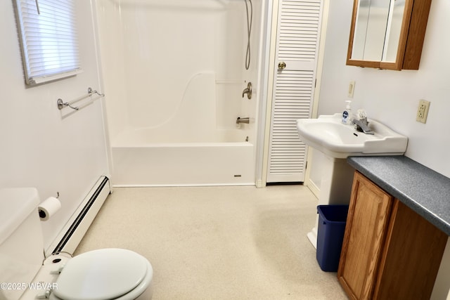 bathroom with a baseboard radiator, bathing tub / shower combination, and toilet