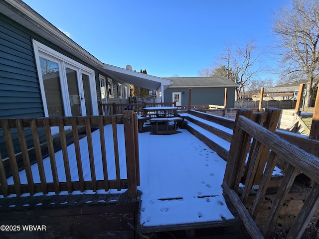 view of snow covered deck