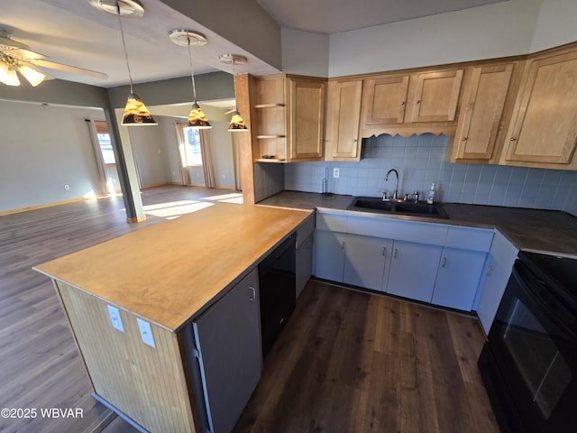 kitchen with sink, black electric range oven, backsplash, kitchen peninsula, and decorative light fixtures