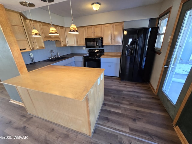 kitchen featuring pendant lighting, black appliances, sink, light brown cabinetry, and tasteful backsplash