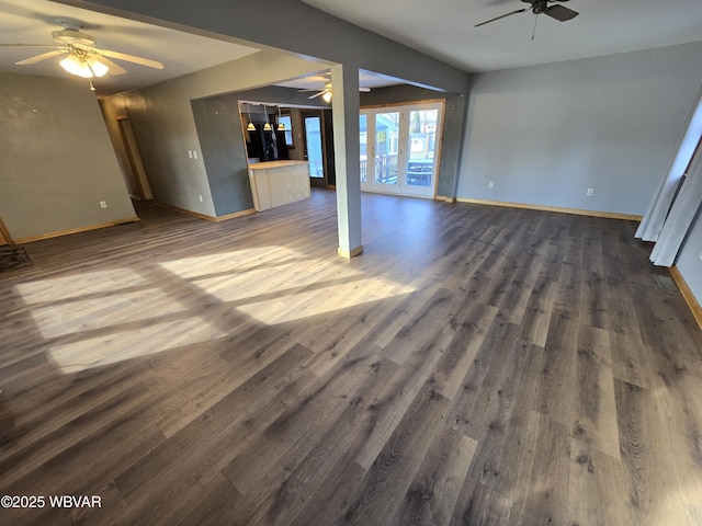 unfurnished living room with dark hardwood / wood-style floors