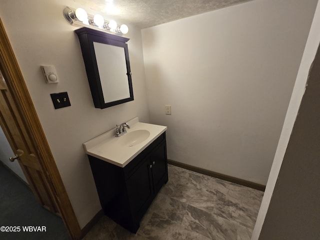 bathroom featuring vanity and a textured ceiling