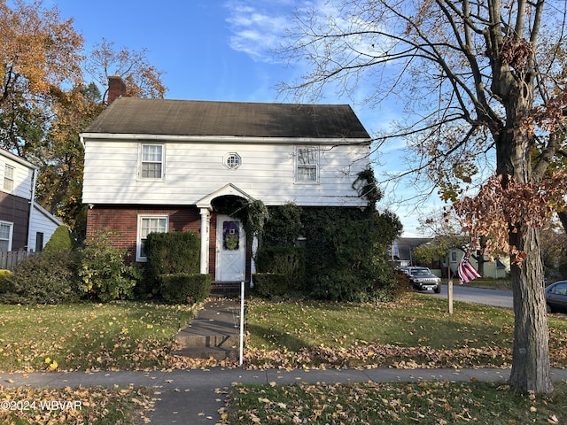 view of front of home with a front yard