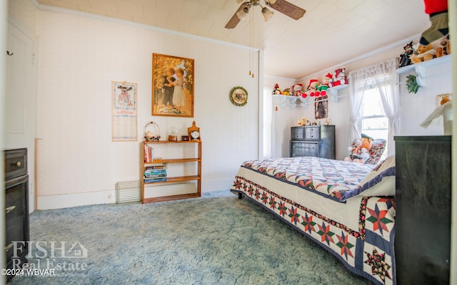 bedroom featuring carpet, ceiling fan, and crown molding