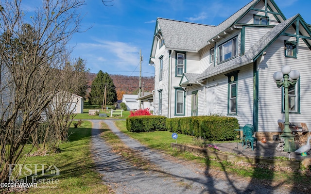 view of property exterior featuring a yard